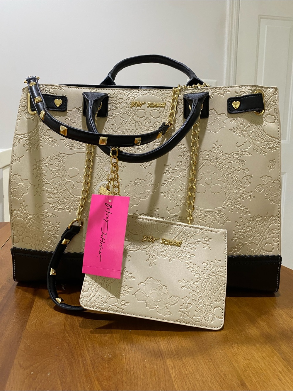 NWT.  Betsey Johnson, cream/black tote with matching wristlet.